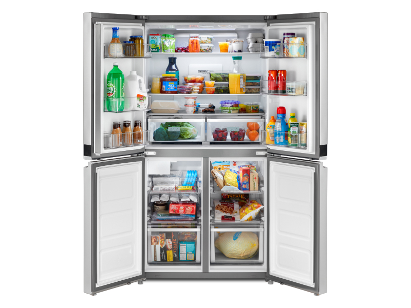 Four door refrigerator opened to show contents