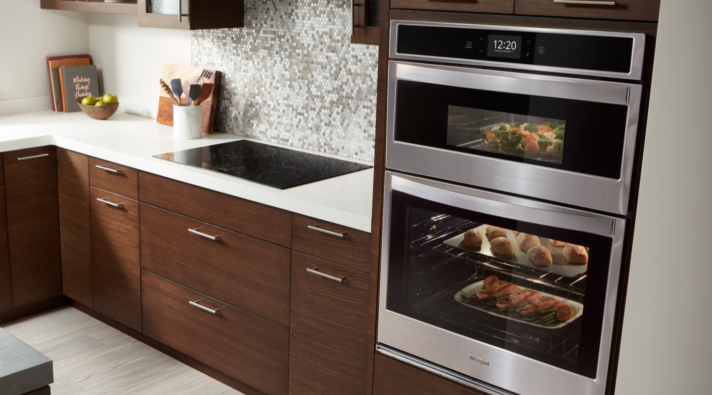 Various dishes cooking in a double wall oven