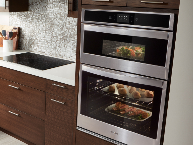Various dishes cooking in a double wall oven