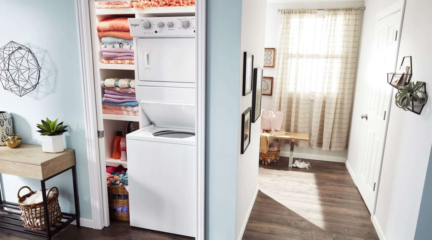 Stacked laundry center in a closet