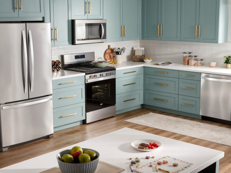 Teal and white kitchen island with three stools