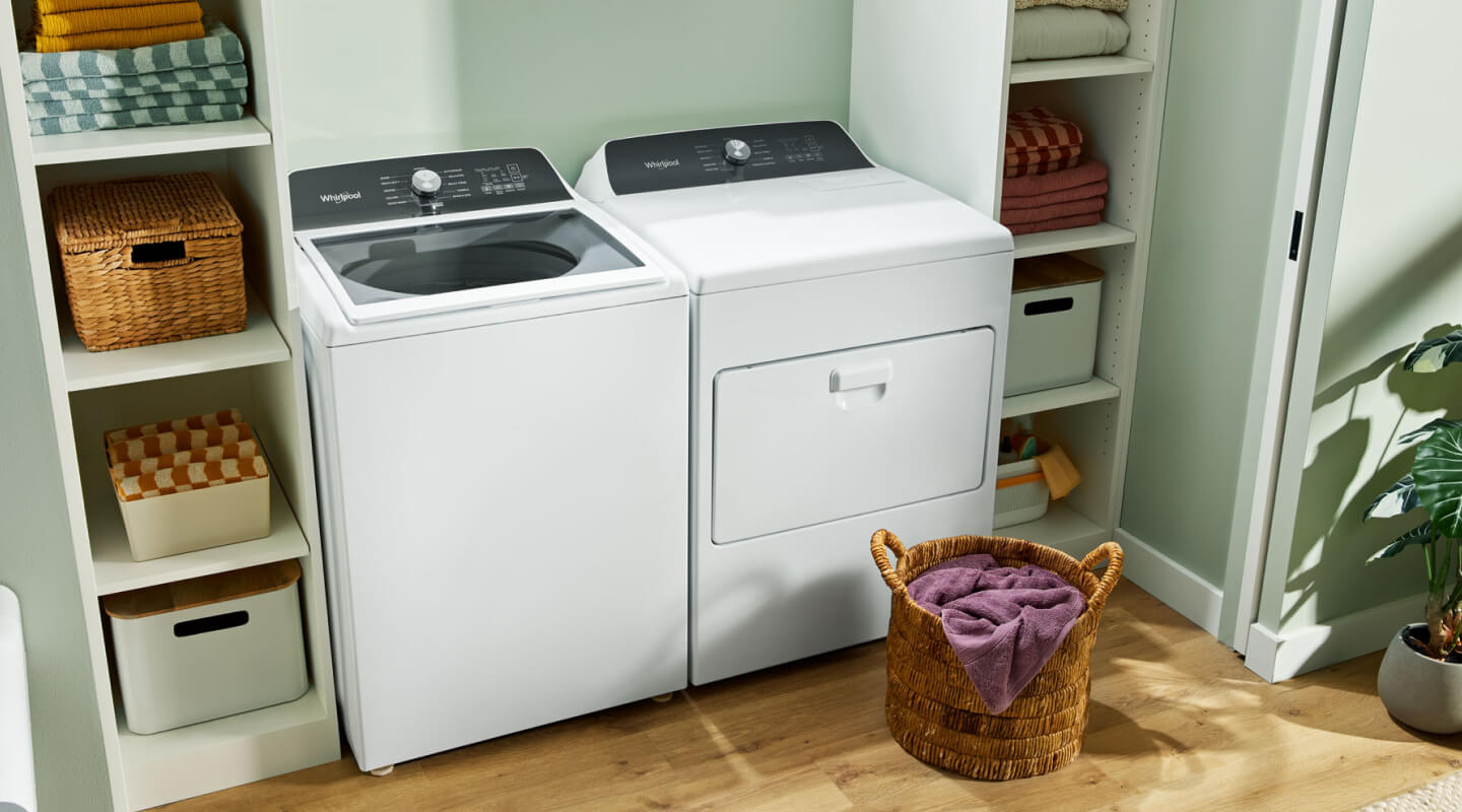 A white Whirlpool® Top-Load Washer and Dryer set
