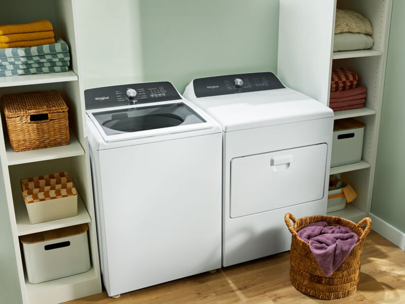 A white Whirlpool® Top-Load Washer and Dryer set