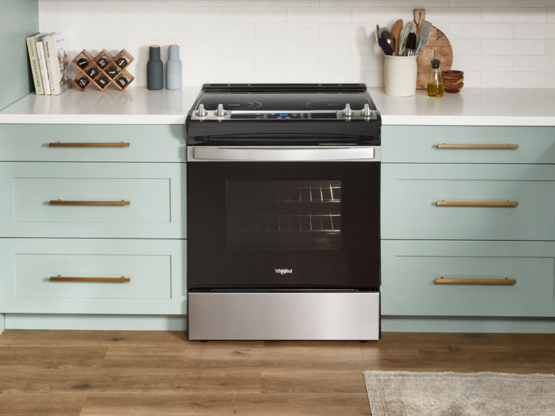 Whirlpool® electric range in a light blue kitchen