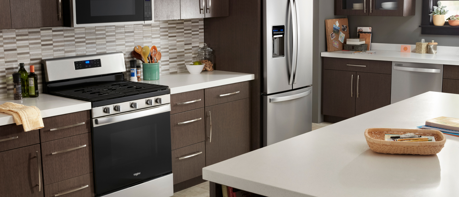 Stainless steel appliances in a kitchen with an island
