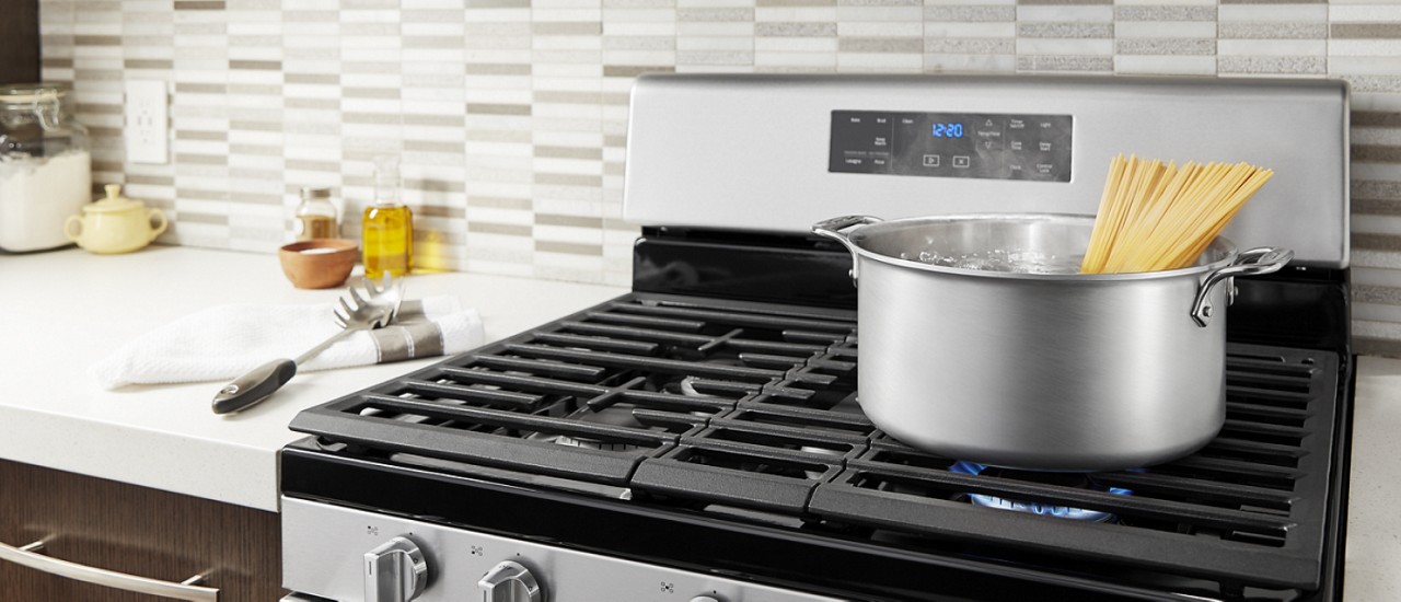 Spaghetti boiling on a gas stovetop