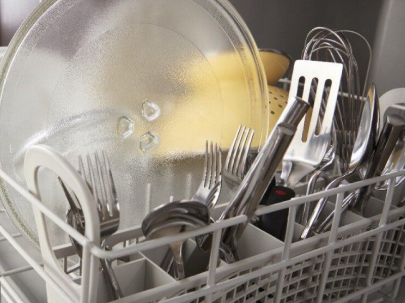 Dishes loaded in the lower rack of a dishwasher
