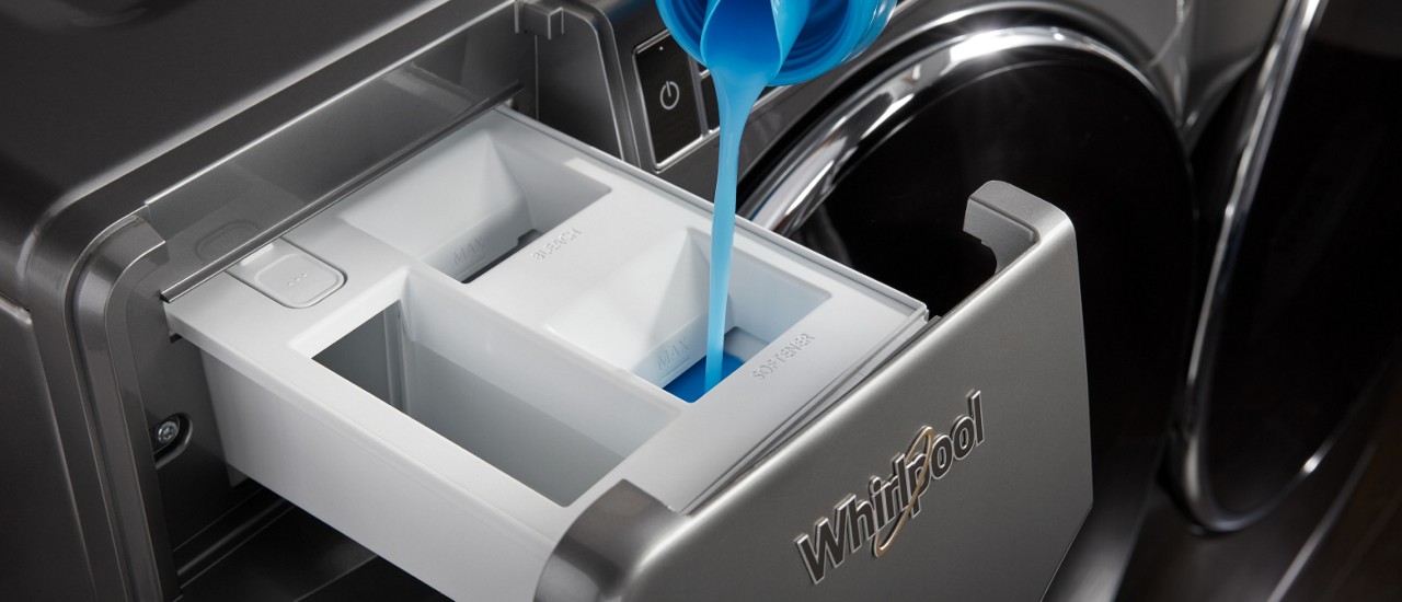 Detergent and fabric softener dispensers in a washer