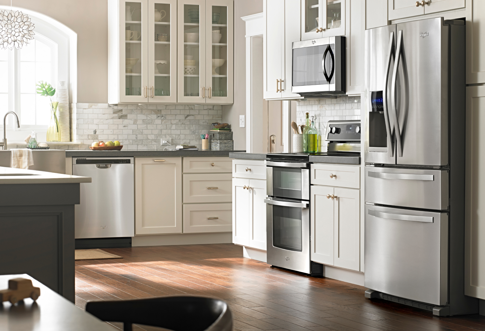 Whirlpool® stainless steel French door refrigerator in open kitchen