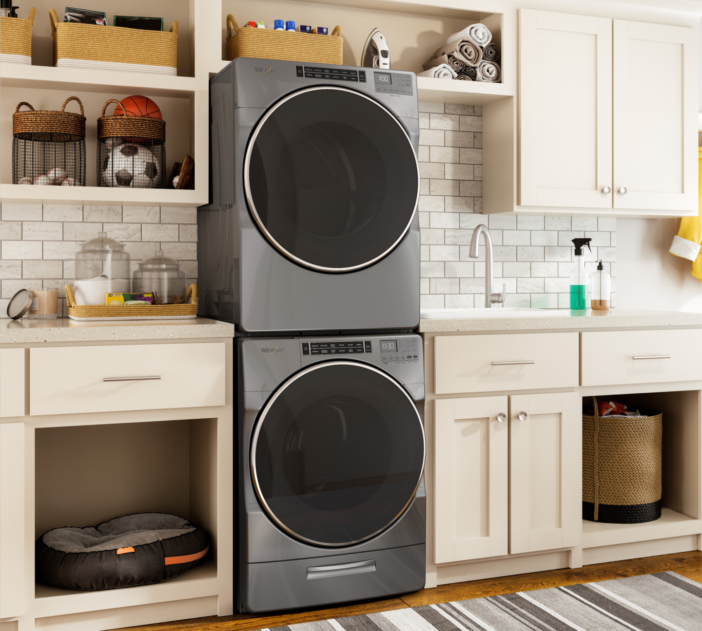 Stacked front-loading Whirlpool® washer and dryer in a laundry room