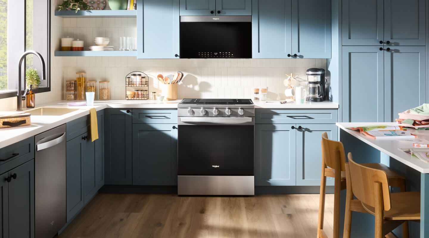 A kitchen with an over-the-range microwave