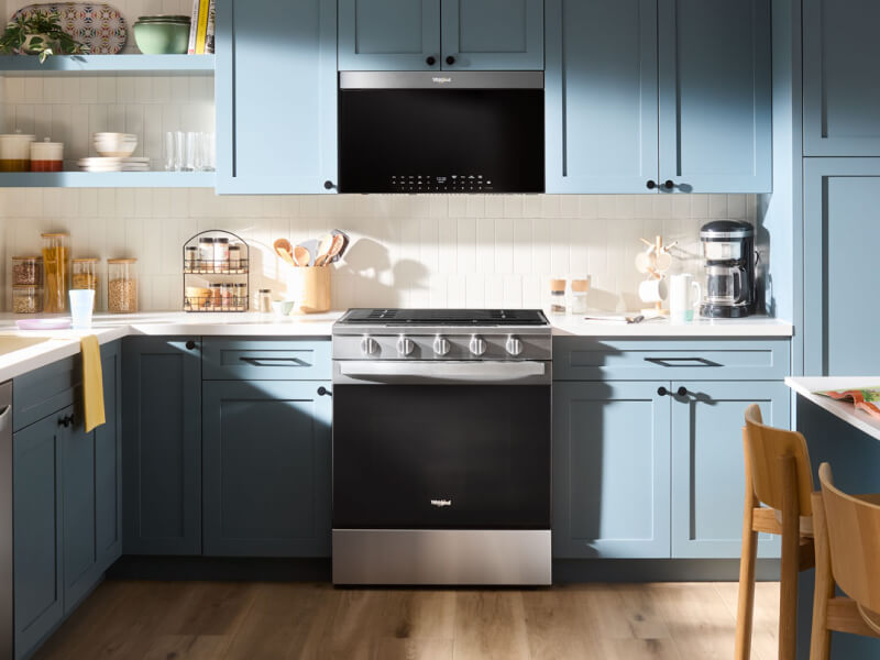 A kitchen with an over-the-range microwave