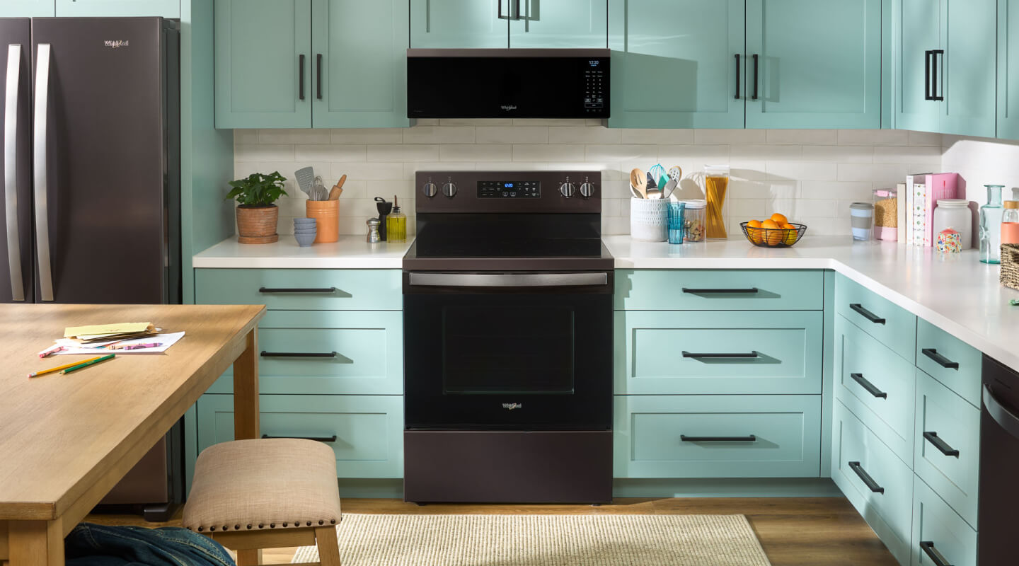 A kitchen with an over-the-range microwave