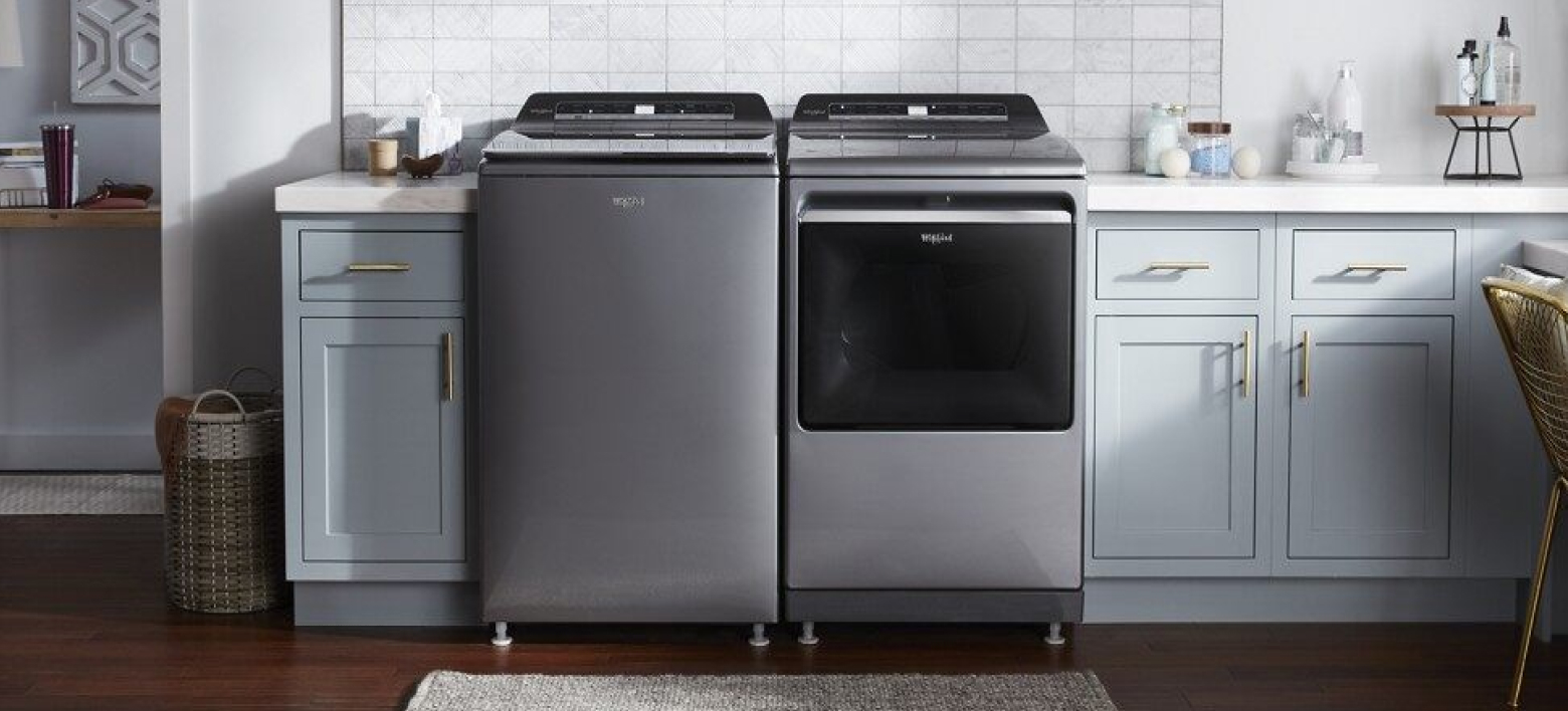 Top load smart washer and dryer in a bright laundry room
