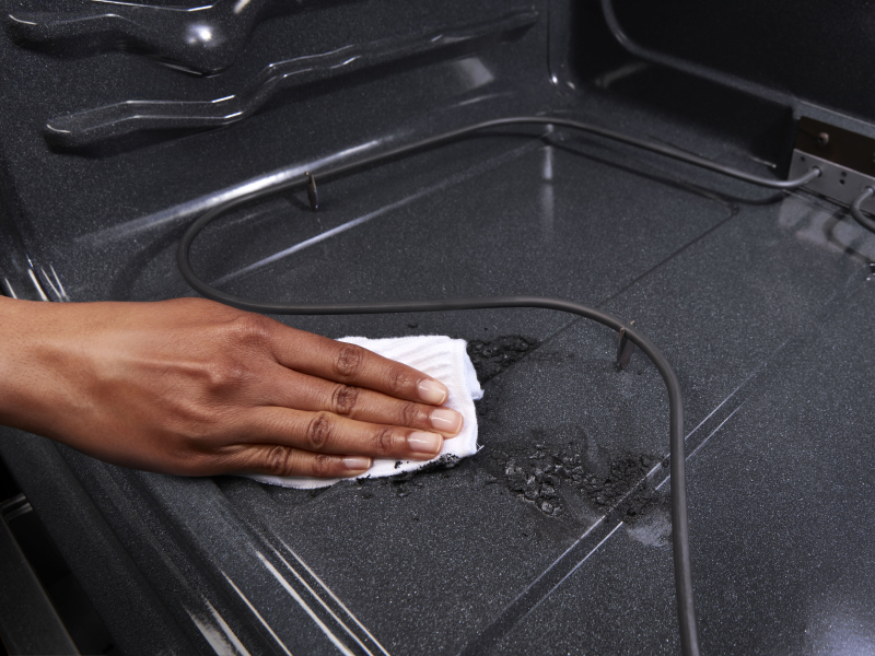 Wiping down an oven