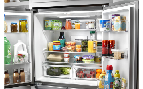 An open, stocked Whirlpool® Refrigerator
