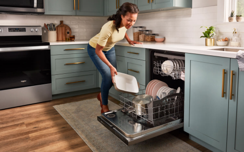 Person loading a dishwasher