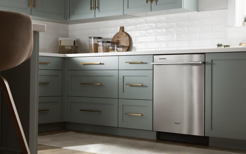 Whirlpool® Dishwasher set in light green cabinetry