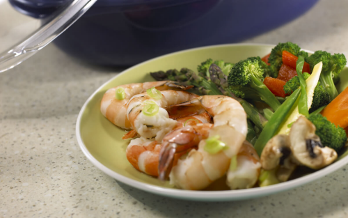 A vegetable and shrimp dish on a plate
