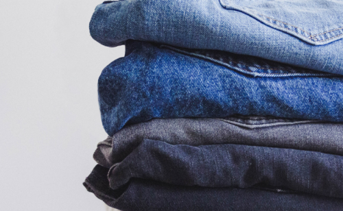 Folded jeans stacked in a pile