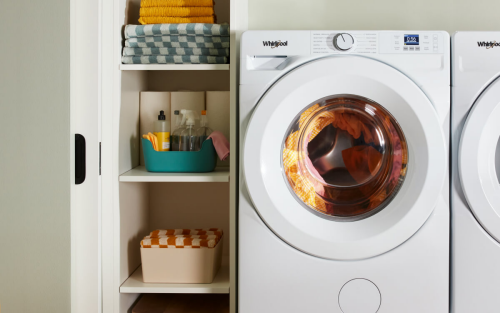White front load washer during a wash cycle