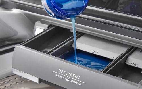Blue high-efficiency detergent and an opened dispenser