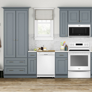 A white dishwasher in a modern grey cabinet kitchen located near dish and utensil storage