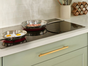Pans with food in them on Whirlpool® Cooktop