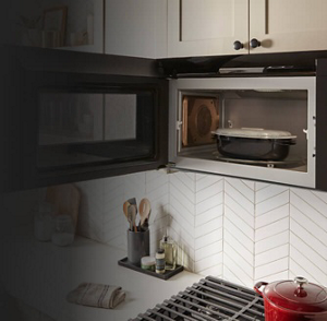 Whirlpool® Microwave open to show contents