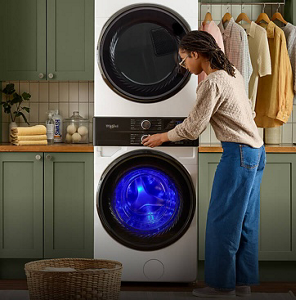 Person taking bright clothing out of their Whirlpool® Front Load Washer